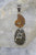 AMMONITE AND PYRITE SHELL PENDANT 1.75"